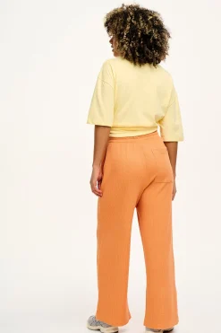 Lucy & Yak Larson - Wide Leg Waffle Cotton Joggers in Sunset Orange Sale